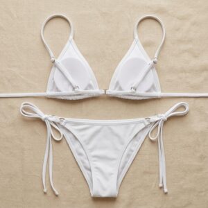 Custom triangle bikini set in white, top and bottom cut from a single dye lot so the pair matches — OEM cut-and-sew swimwear manufacturing