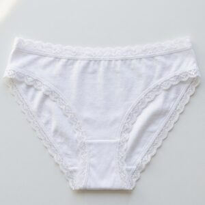 Women's cotton bikini briefs with scalloped lace trim at waist and leg openings