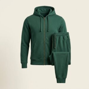 Ghost mannequin product photo of a matching tracksuit set, full-zip hoodie and jogger sweatpants in identical deep pine green French terry fabric, front view
